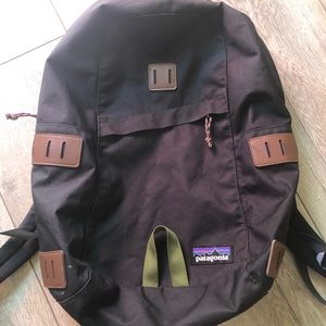 Patagonia Backpack in green (think black with a touch of green) and leather